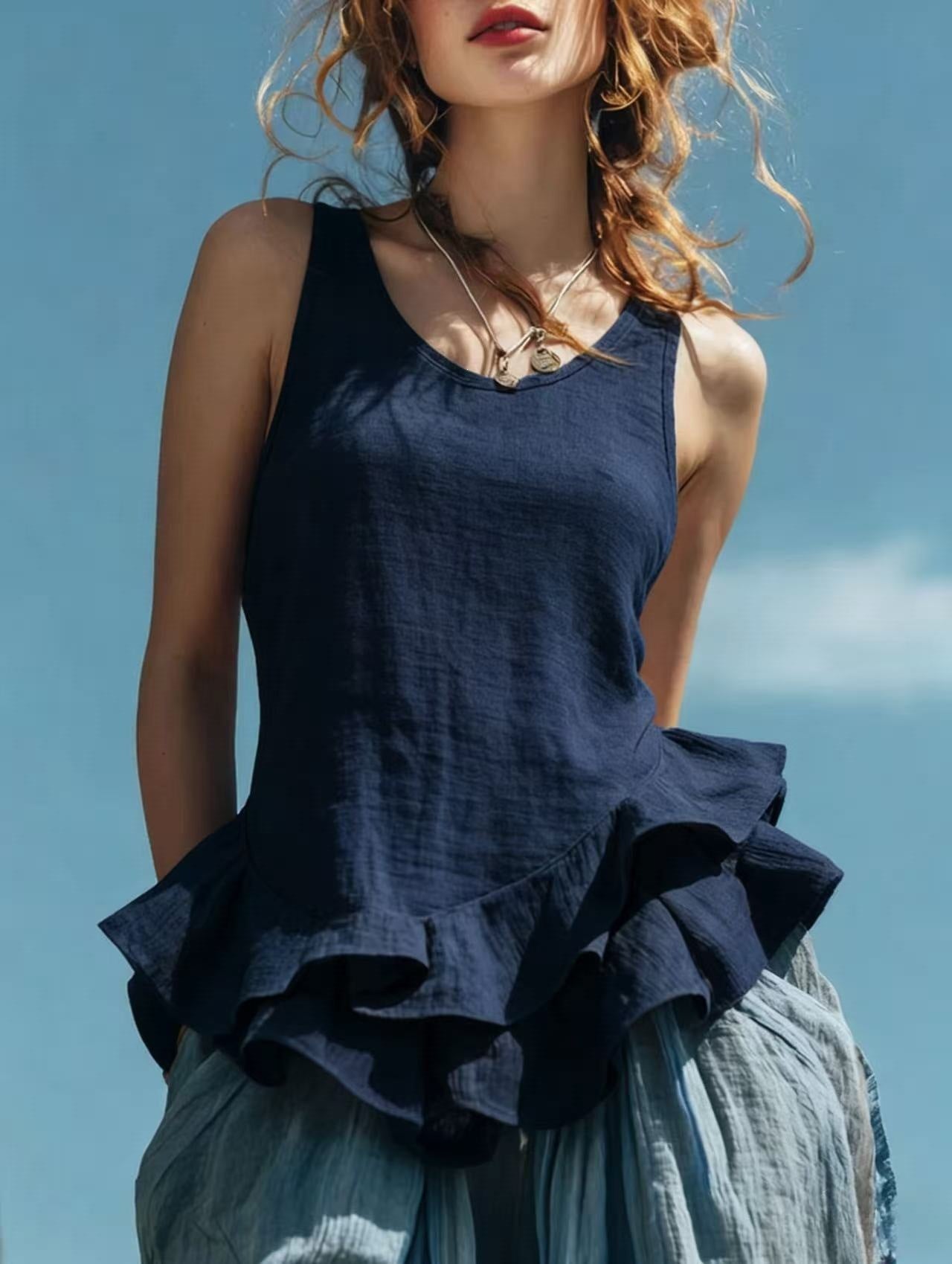 Sleeveless women's top with ruffled hem